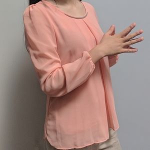 Apricot blouse with gold neckline